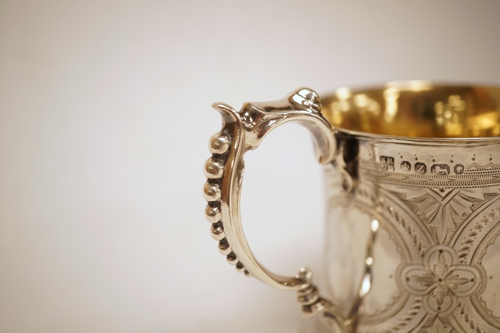 A Victorian bright cut engraved silver christening mug, of waisted form, with engraved inscription and beaded handle, Samuel Roberts & Charles Belk, Sheffield, 1867, 82mm, 5.2oz.
